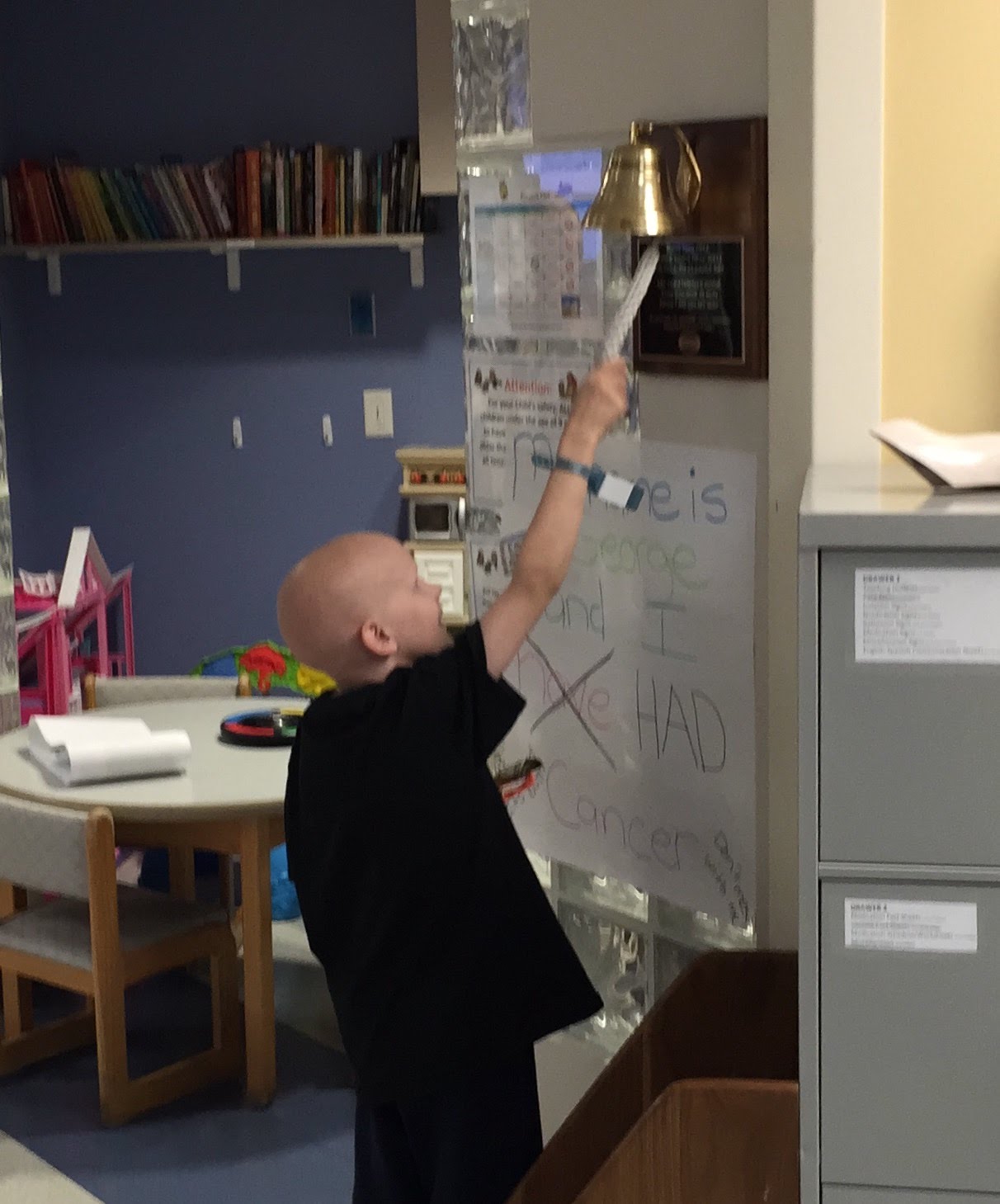 Child ringing a treatment bell